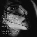 She doesn't trust words anymore, words are fleeting. She trusts actions, actions come from the soul, they prove intention more than words.